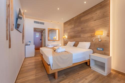 Postel nebo postele na pokoji v ubytování Arte Hotel