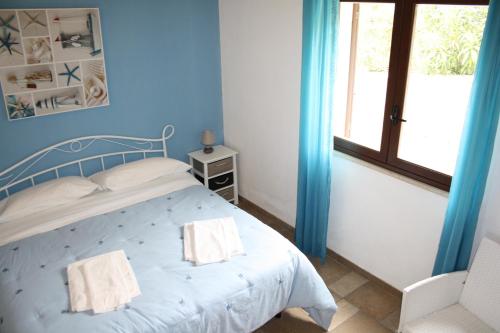 Een bed of bedden in een kamer bij Villa Rossana