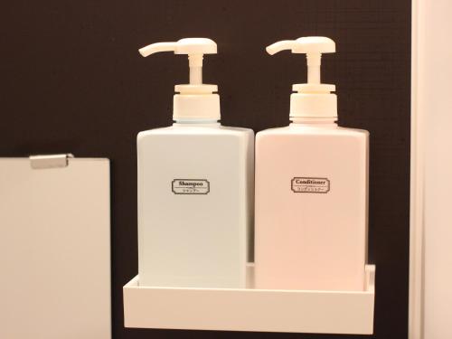 two white bottles ofodorizers are sitting on a shelf at Base in Onnason,Okinanawa in Onna