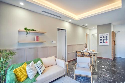 a living room with a couch and a table at Royce Residence KLCC by Cobnb in Kuala Lumpur