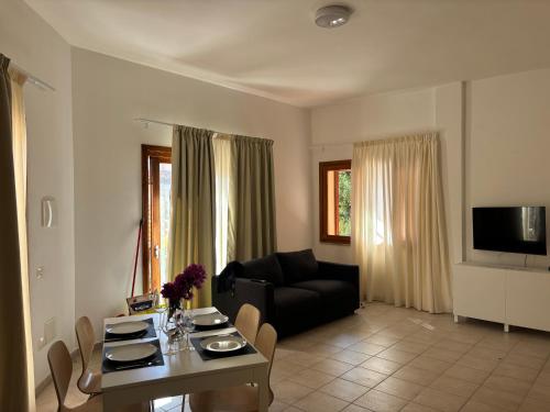 a living room with a couch and a table at Case sul mare in Palau