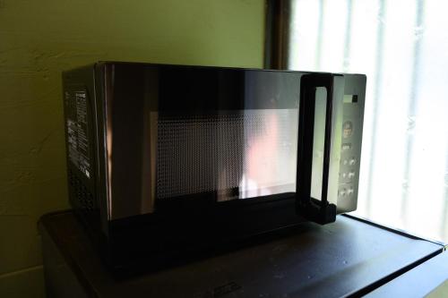 a microwave oven sitting on top of a table at Kino in Takamatsu