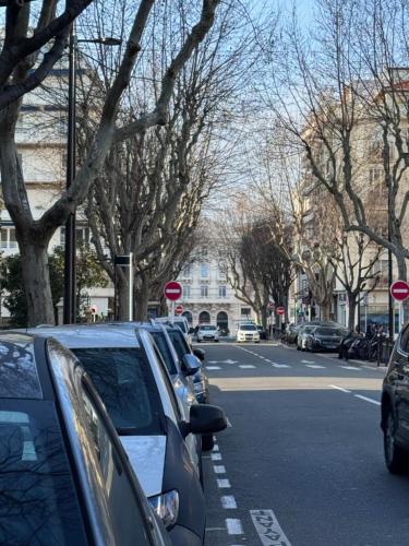a row of cars parked on the side of a street at Le Nid Douillet du Carré d'OR in Antibes
