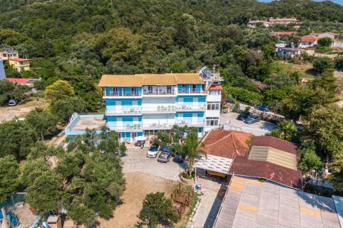 an aerial view of a building with a parking lot at Alex bar apartments in Sarakiniko