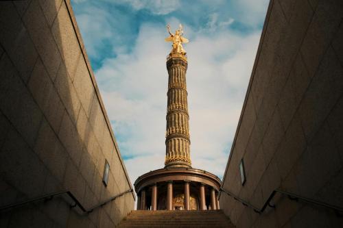 a statue of a christ redeemer on top of a tower at Garner Hotel Berlin - Schöneberg by IHG in Berlin