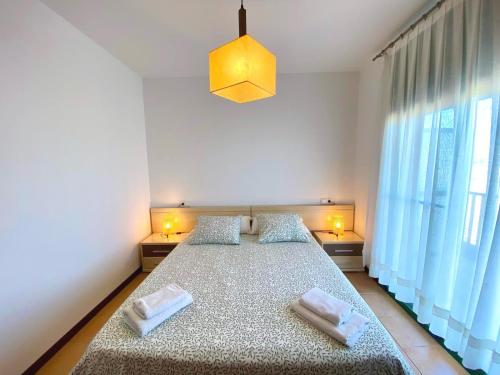 Katil atau katil-katil dalam bilik di Apartament Arrossar