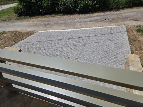 a bench sitting on the side of a road at Vinárska chata in Trnovec