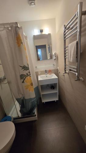 a bathroom with a sink and a mirror at The Golden Secret Court in Venice