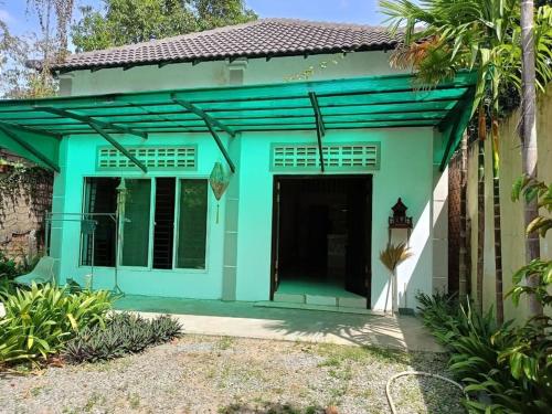 A two-bedroom home with natural light and green environment