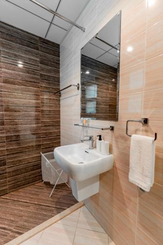 a bathroom with a sink and a mirror at Seascape Villa Marine in Fujairah