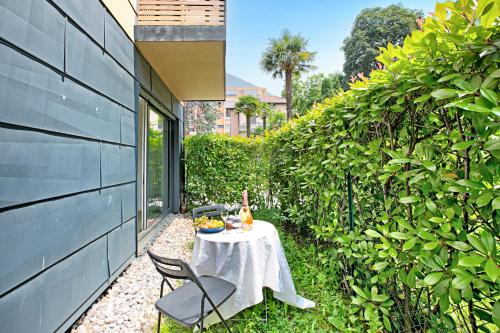 a table and chairs sitting on a patio at Viganello Modern Apartments in Lugano