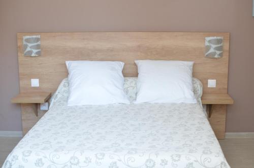 Llit o llits en una habitació de Mistral Appartements