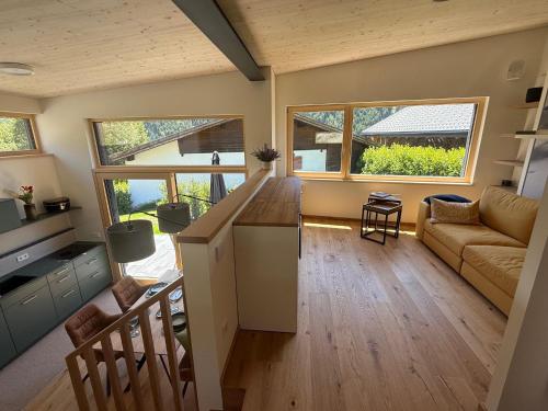 a living room with a couch and a table at Haus Albuin in Sankt Gallenkirch