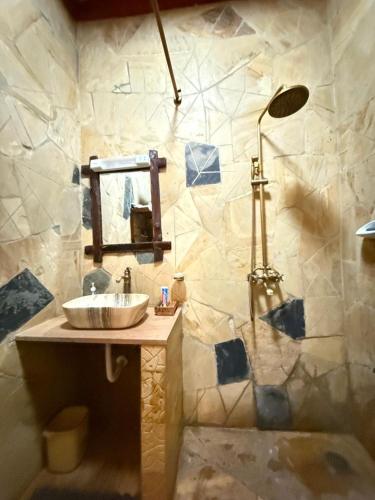 a bathroom with a sink and a shower at The Fort Valley BnB , Karatu in Karatu