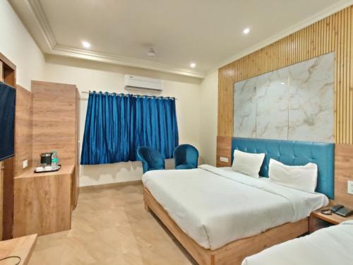 Cama ou camas em um quarto em Dee Intercontinental