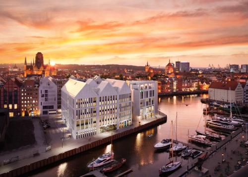 a view of a city with boats in the water at Holiday Inn Gdansk - City Centre by IHG in Gdańsk