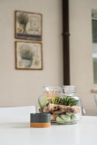 a glass jar filled with vegetables on a counter at Ravenna garden house in Ravenna