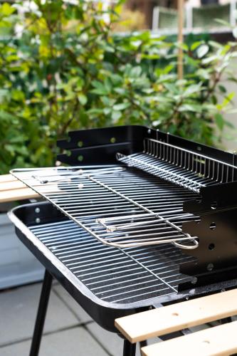 a grill sitting on top of a picnic table at Ravenna garden house in Ravenna