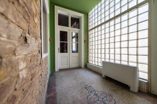 Кровать или кровати в номере East-West Budapest Boutique Hotel