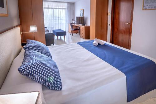 Postel nebo postele na pokoji v ubytování 4R Gran Regina