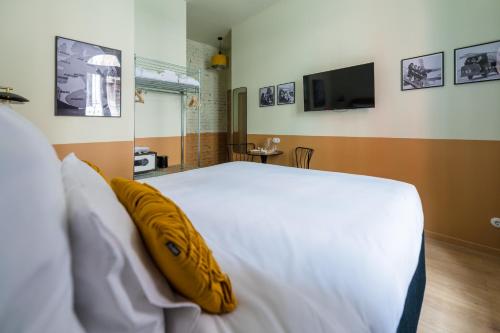 Кровать или кровати в номере East-West Budapest Boutique Hotel