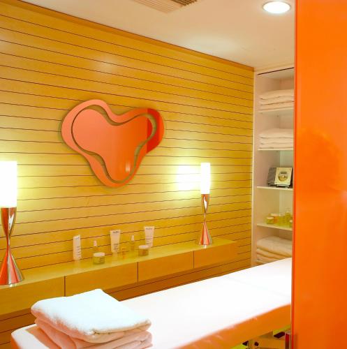 an orange room with a heart on the wall at Semiramis in Athens