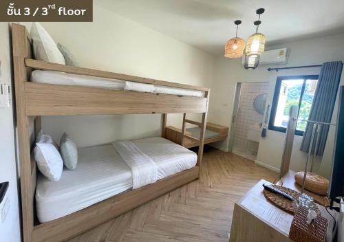 Ένα ή περισσότερα κρεβάτια σε δωμάτιο στο My Uthai Hotel