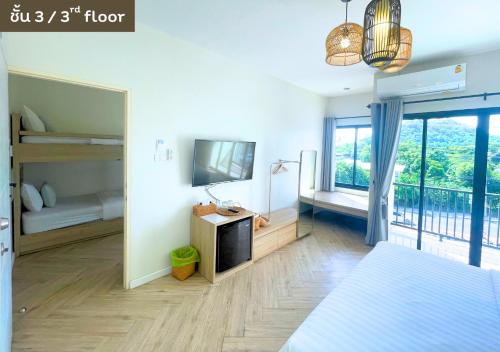 Ένα ή περισσότερα κρεβάτια σε δωμάτιο στο My Uthai Hotel
