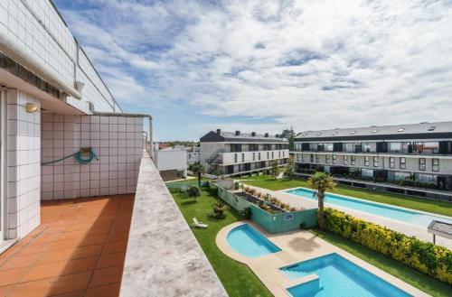 an apartment with a swimming pool on a building at Ofir Beach Lodge by Minho's Guest in Fão