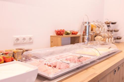 a kitchen counter with a tray of meat on it at Haus Sattelblick in Sankt Anton am Arlberg