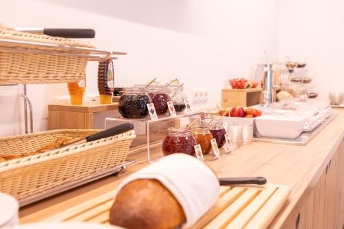 a kitchen with a counter with bread and other foods at Haus Sattelblick in Sankt Anton am Arlberg