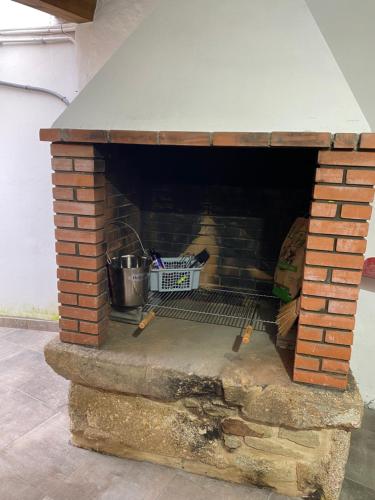 a brick oven with a basket inside of it at Casa Erundina in Camariñas