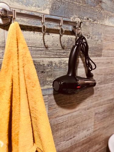 a towel hanging on a wall with a hook at Spacious studio 5 min to the sea in Batumi
