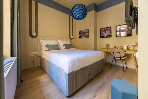 Кровать или кровати в номере East-West Budapest Boutique Hotel