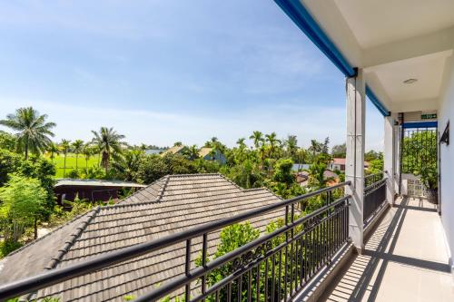 a balcony with a view of a house at Blessing Villa Hoi An in Hoi An