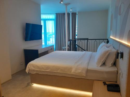 Ένα ή περισσότερα κρεβάτια σε δωμάτιο στο Hotel Zenith