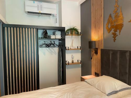a bedroom with a bed in a room with at Omega Lake Apartments in Olsztyn