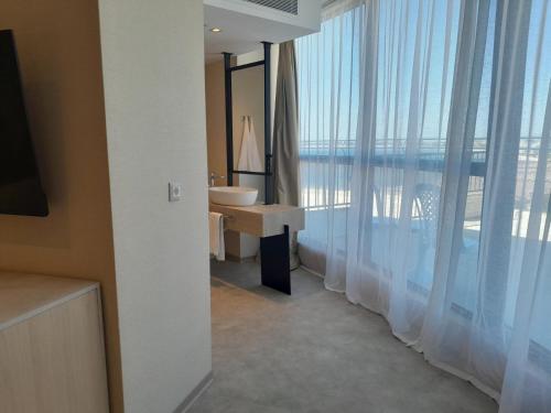 Ένα ή περισσότερα κρεβάτια σε δωμάτιο στο Hotel Zenith