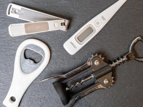 a table with a pair of scissors and a revolver at Hotel Art Stay Naha Kokusai-Dori in Naha