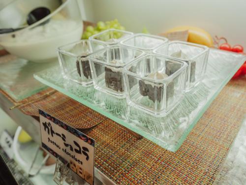 a group of glass containers sitting on top of a table at Hotel Art Stay Naha Kokusai-Dori in Naha