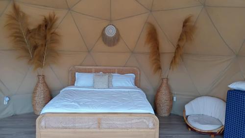 a bedroom with a bed in a yurt at Mahkota Sangkuriang Bandung in Bandung