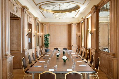 a large conference room with a long table and chairs at The Westin Palace, Milan in Milan