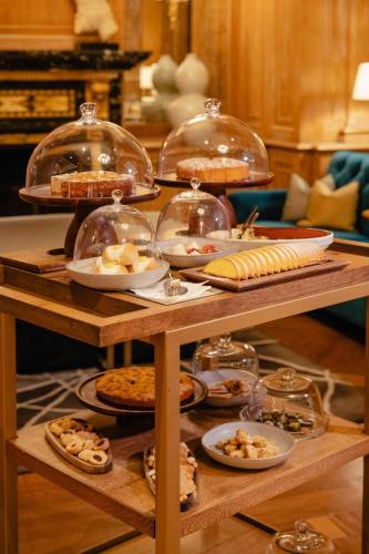 a table with many different types of food on it at The Westin Palace, Milan in Milan