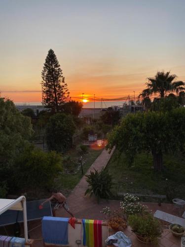 a view of a sunset from a balcony of a house at La Lampara sul Mare in Torrenova