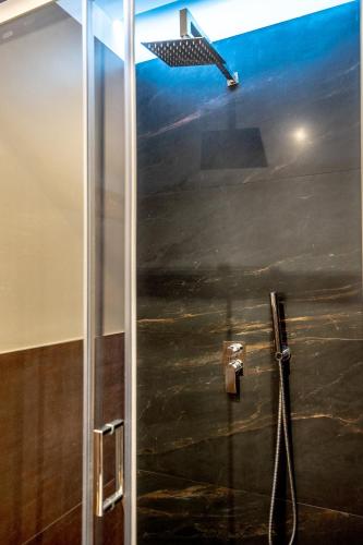 a shower stall with a view of an airplane at Olympus in Avola