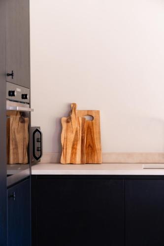 a kitchen with wooden utensils on a counter top at VAKANTIEDOMEIN DOUVE in Heuvelland