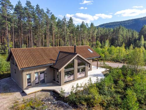 an overhead view of a house in the woods at Det Kosekroken – Nordic Style Holiday Home by the Fjord in Vradal
