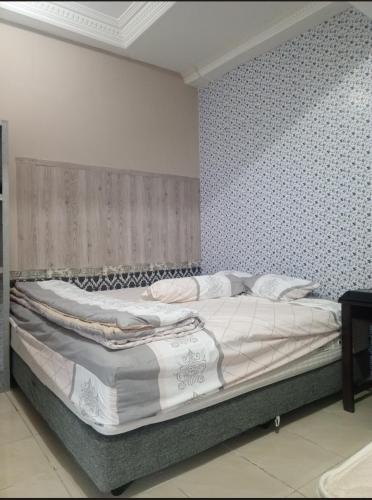 Postel nebo postele na pokoji v ubytování Homestay Aditya
