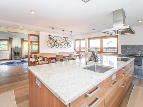 a kitchen with a sink and a counter top at Suite Spielberg in Fieberbrunn