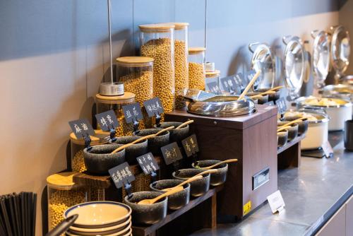 a store with a display of food items on a shelf at Atour Light Hotel Shandong University Central Campus in Jinan